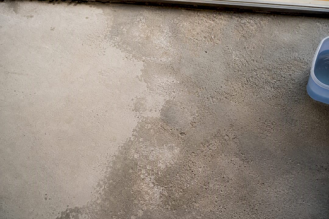 Blotchy unevenly etched concrete surface