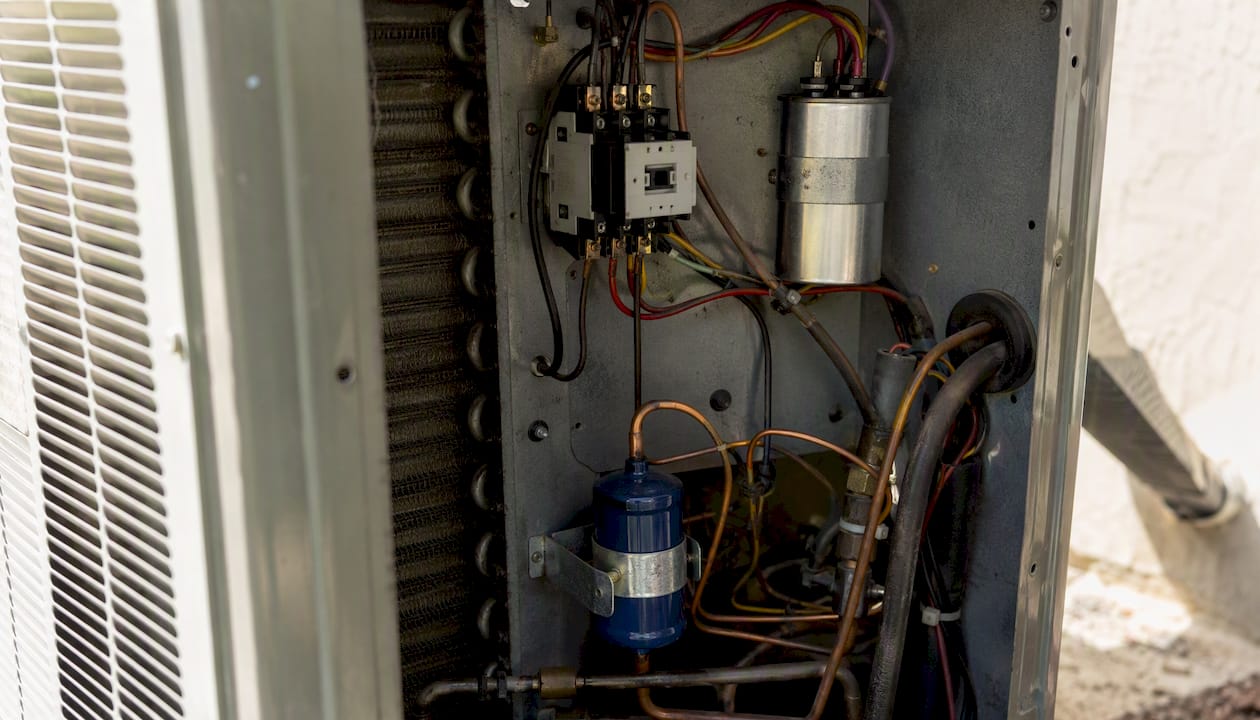 HVAC replacement parts inside outdoor AC unit