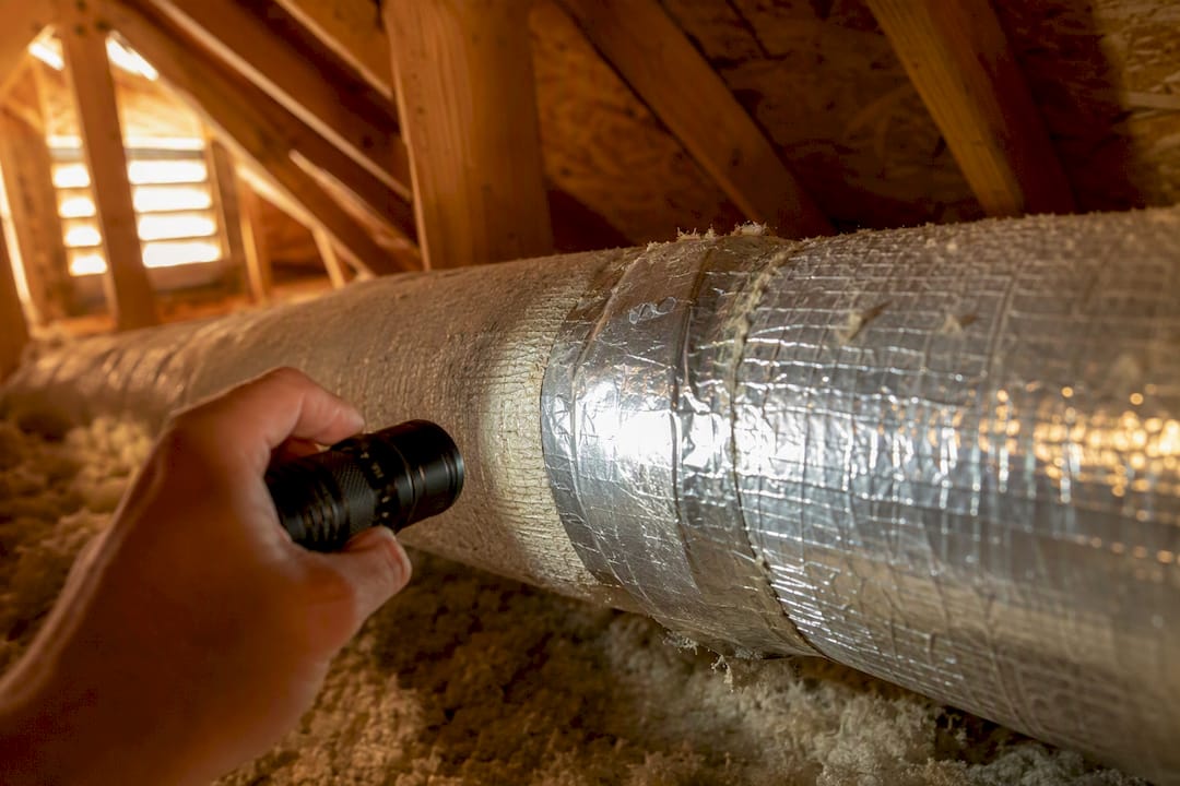 Hand inspecting insulated ductwork joint