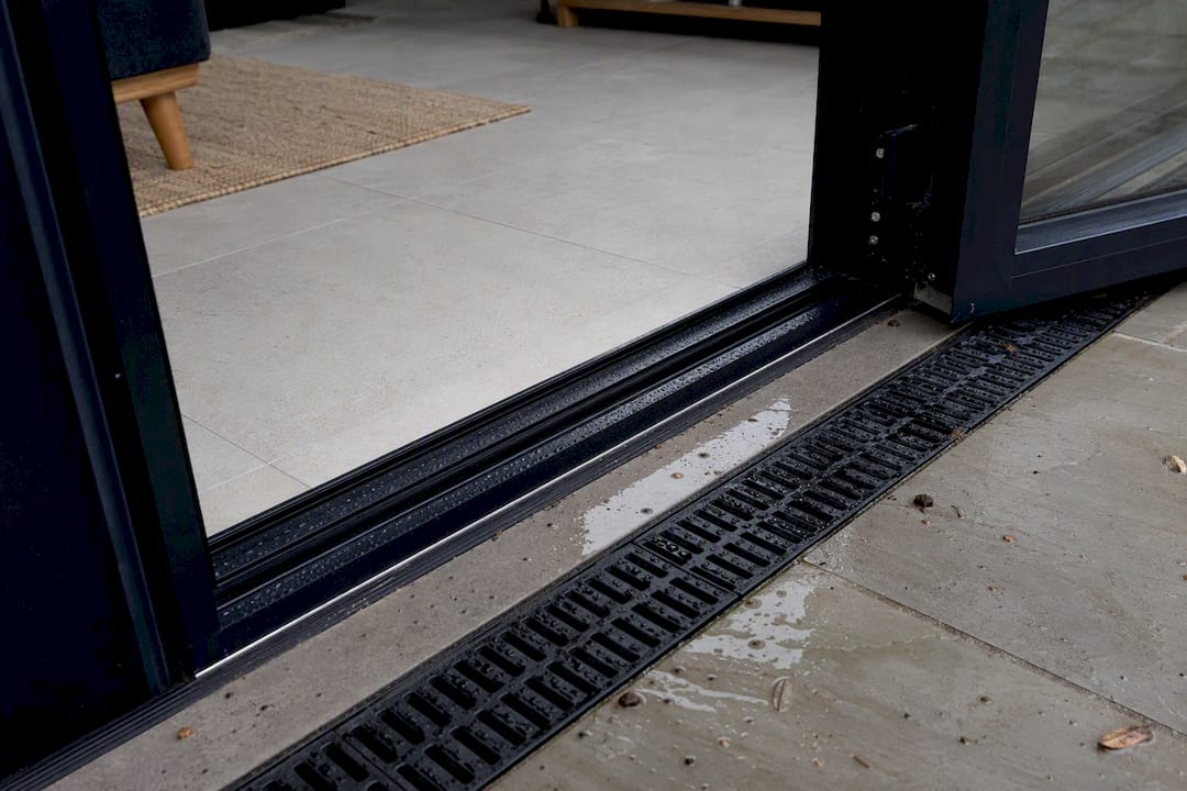 Level threshold patio doors: accessibility meets drainage