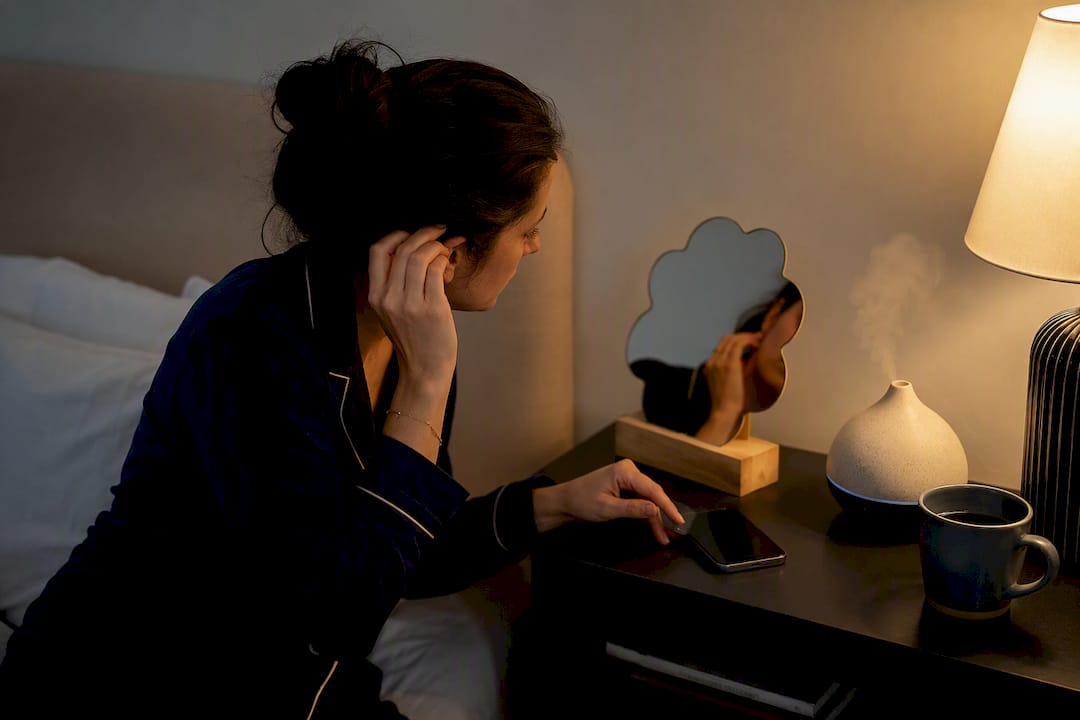 Person preparing for hair density photo at night