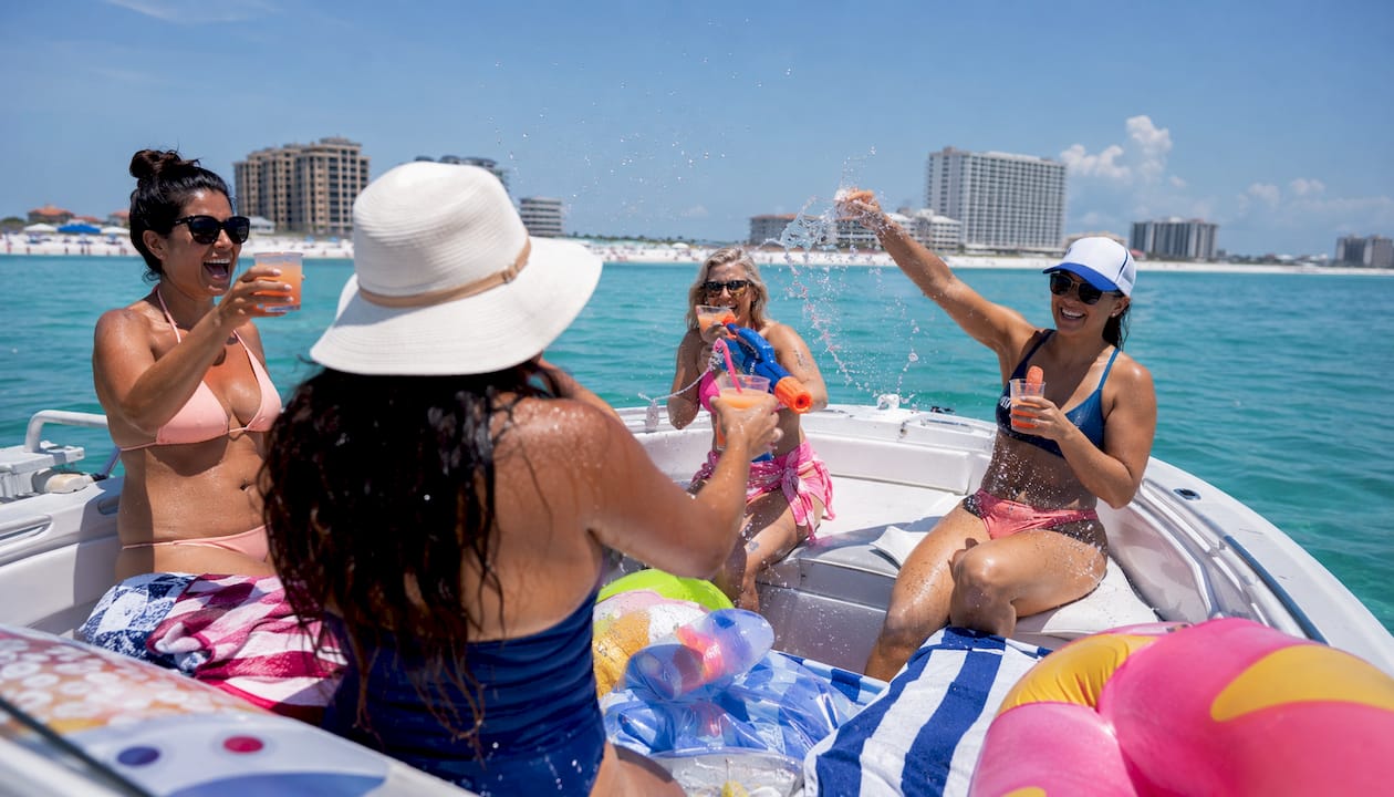 Women celebrating bachelorette party on private boat