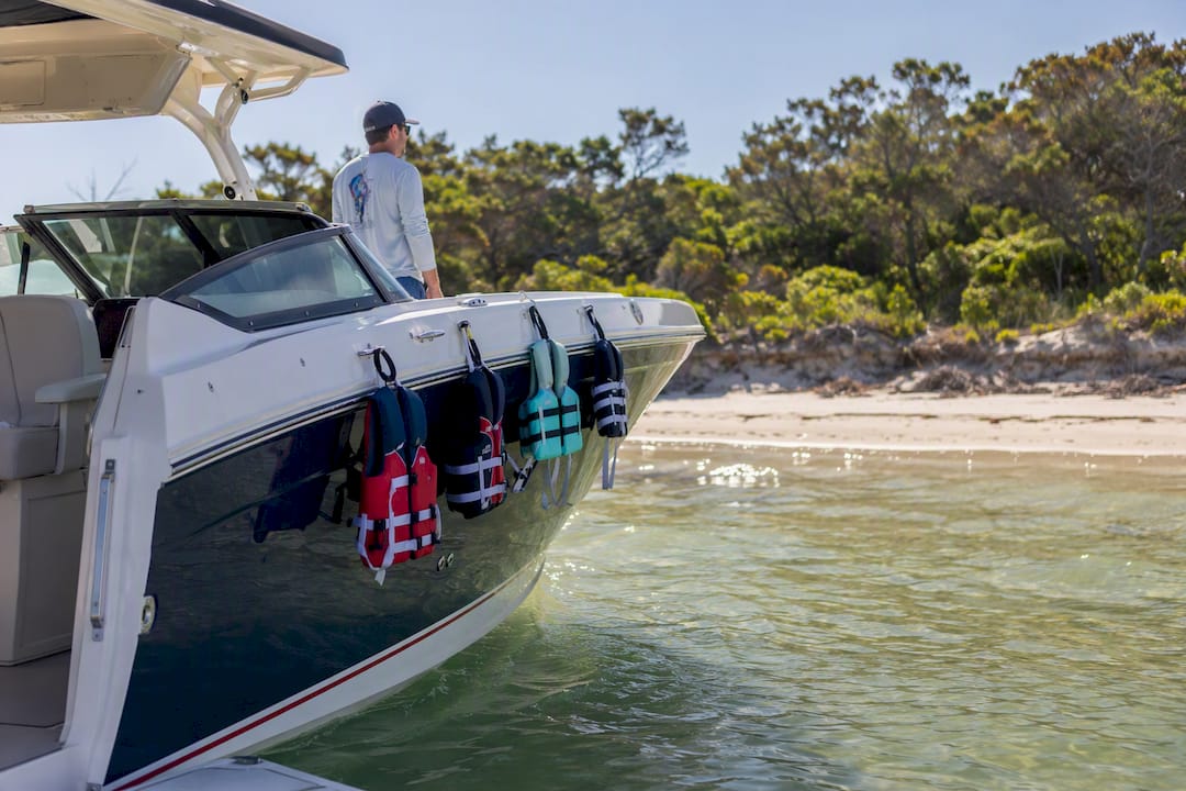 Private luxury boat anchored near Shell Island with child life jackets