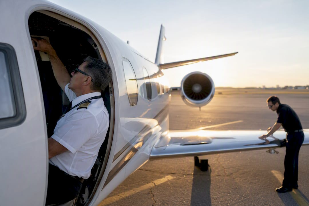Charter flight crew prepping airplane