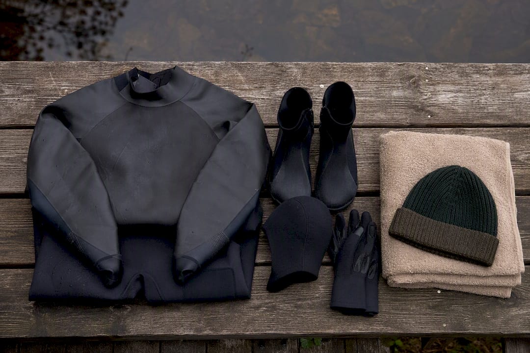 Cold-water swimming gear beside a Swedish lake