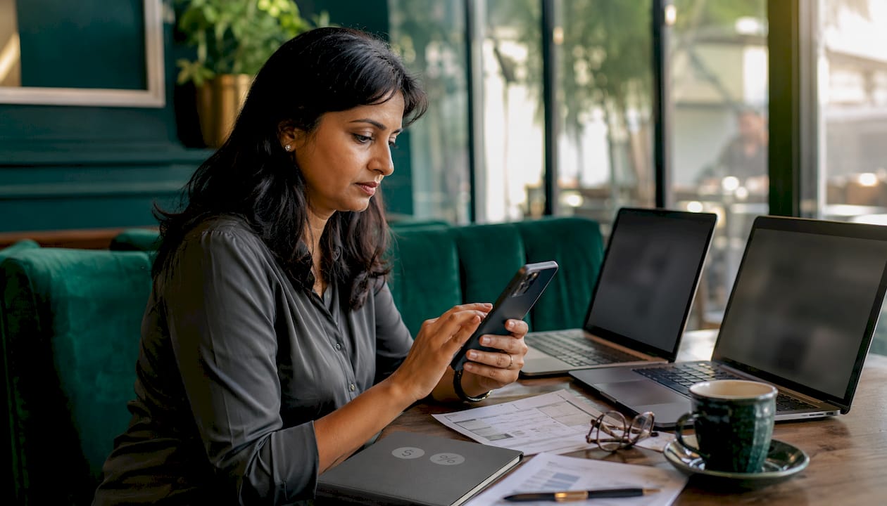 Woman coordinating service texts in office