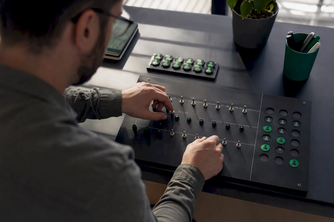 Hands adjusting physical role permission controls