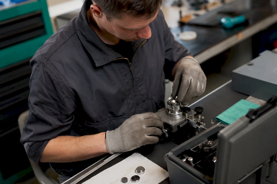 Technician adjusting measurement tool