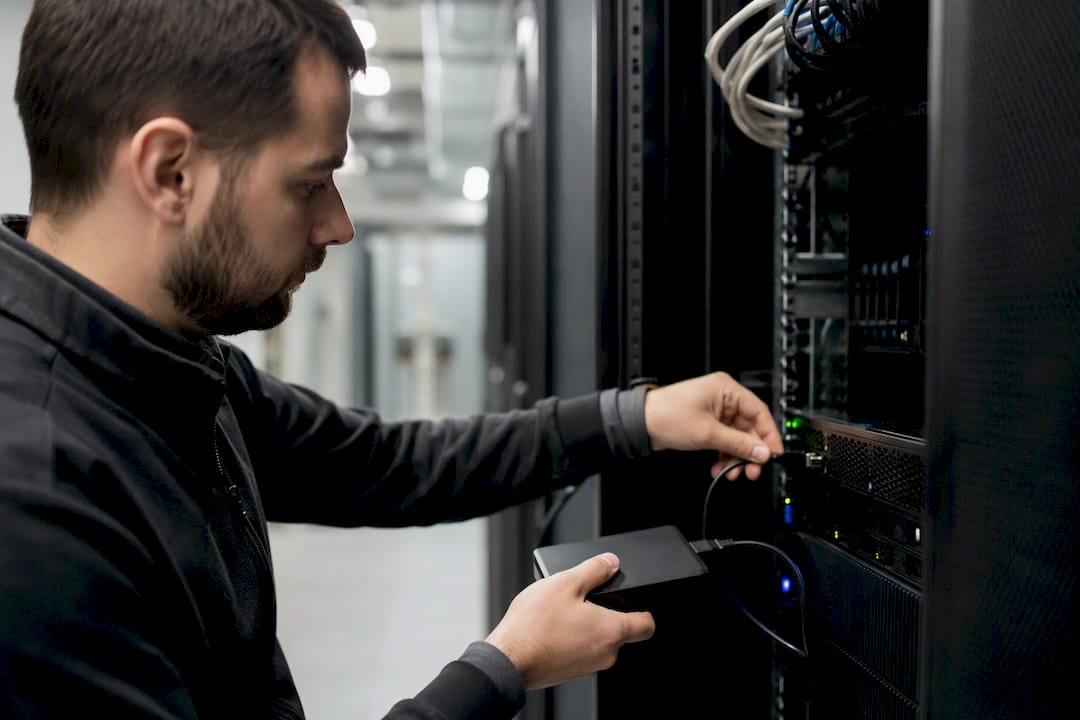 Technician backing up server logs