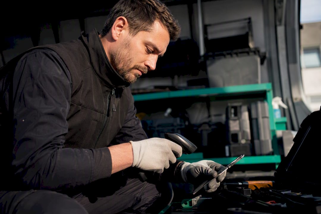 Technician inspecting tools on site