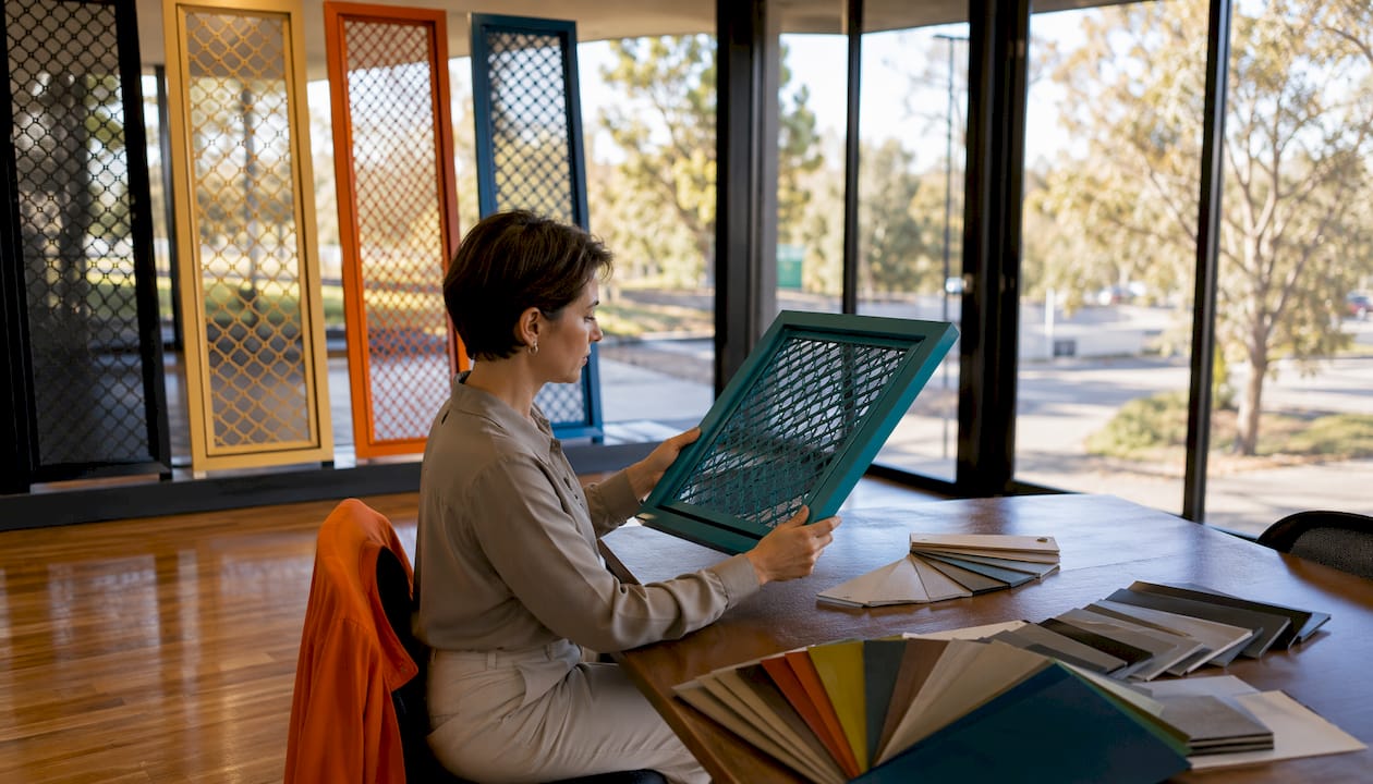 Designer selecting custom colours for Crimsafe screens