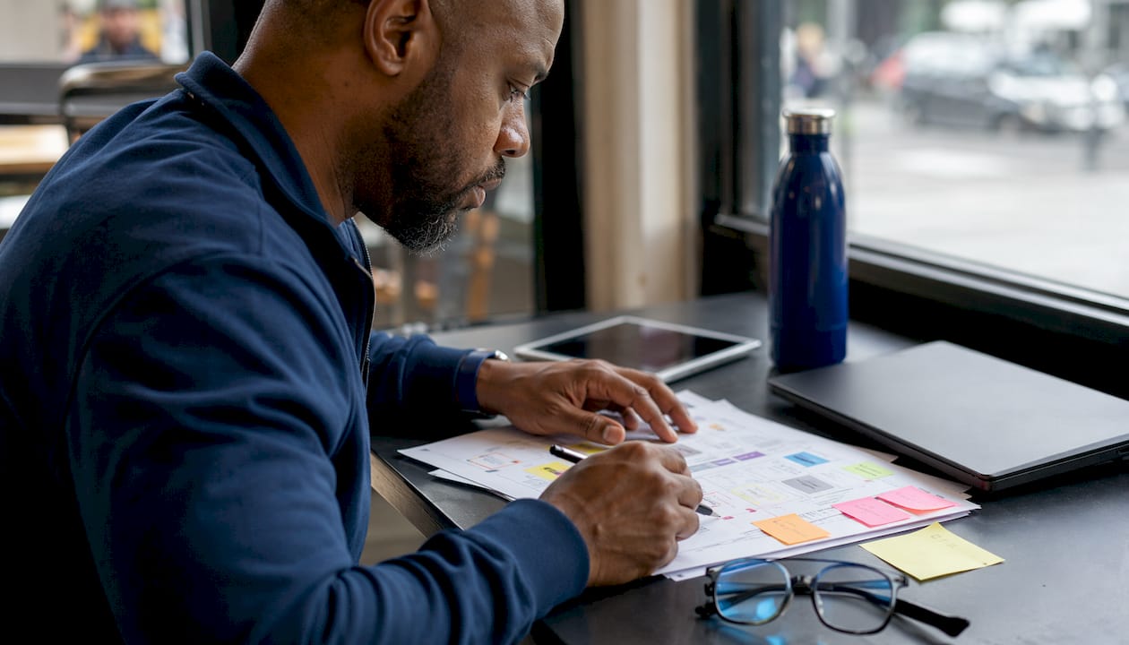 SEO specialist reviewing technical audit documents