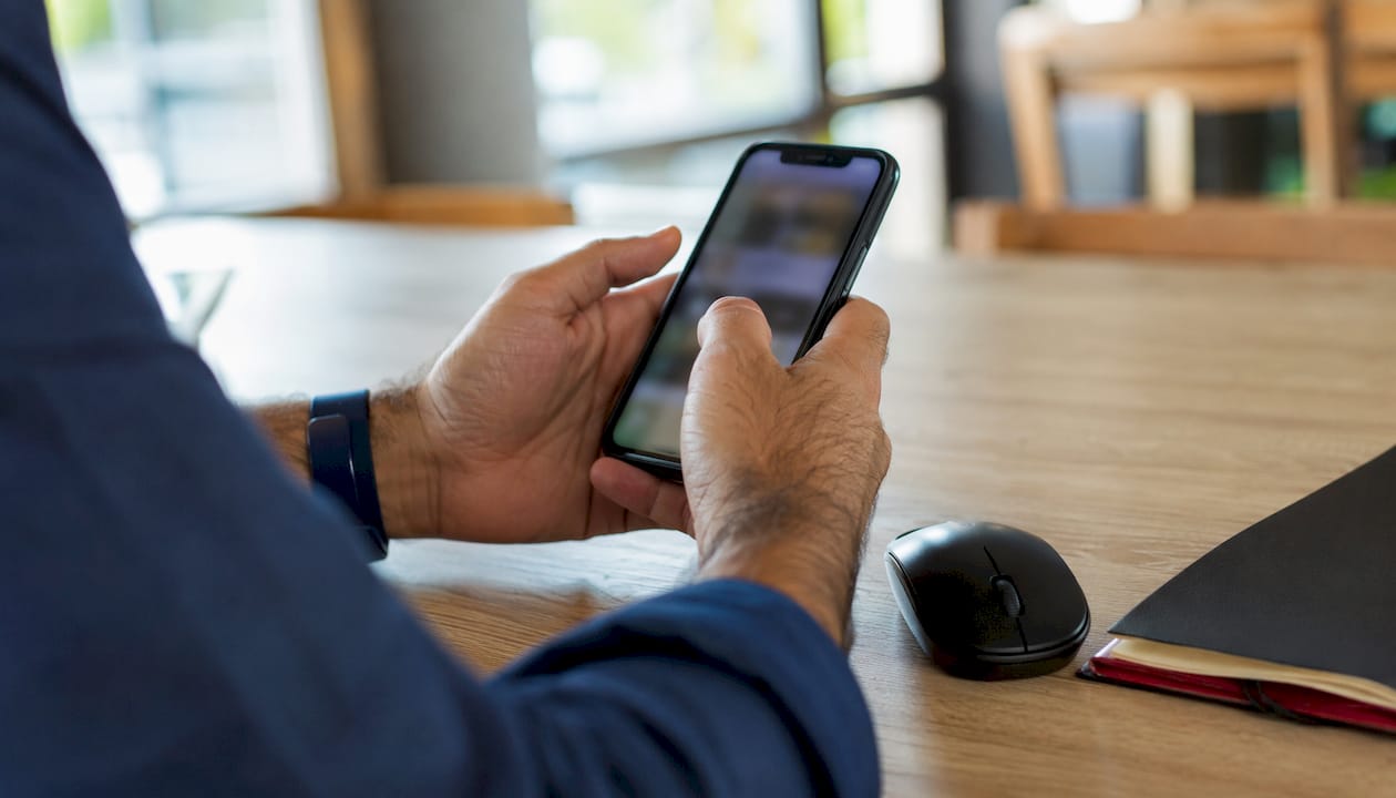 Close-up of hands testing mobile usability on smartphone