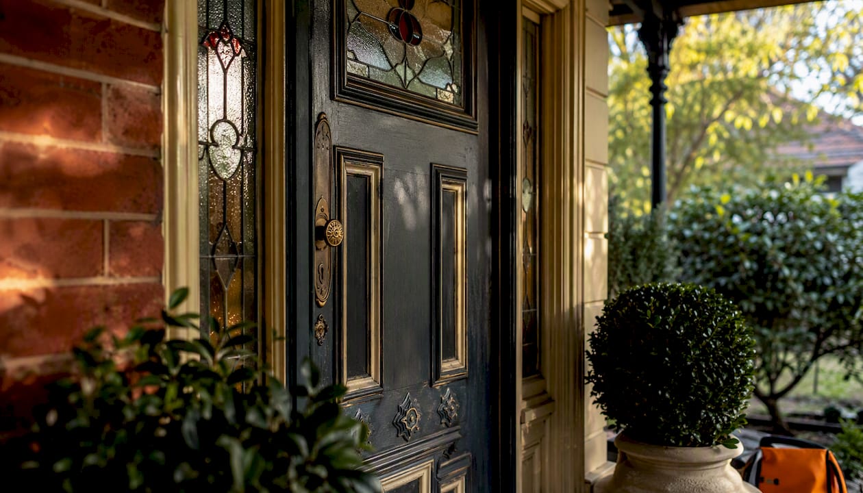 Close-up of Victorian heritage front door with ornate details
