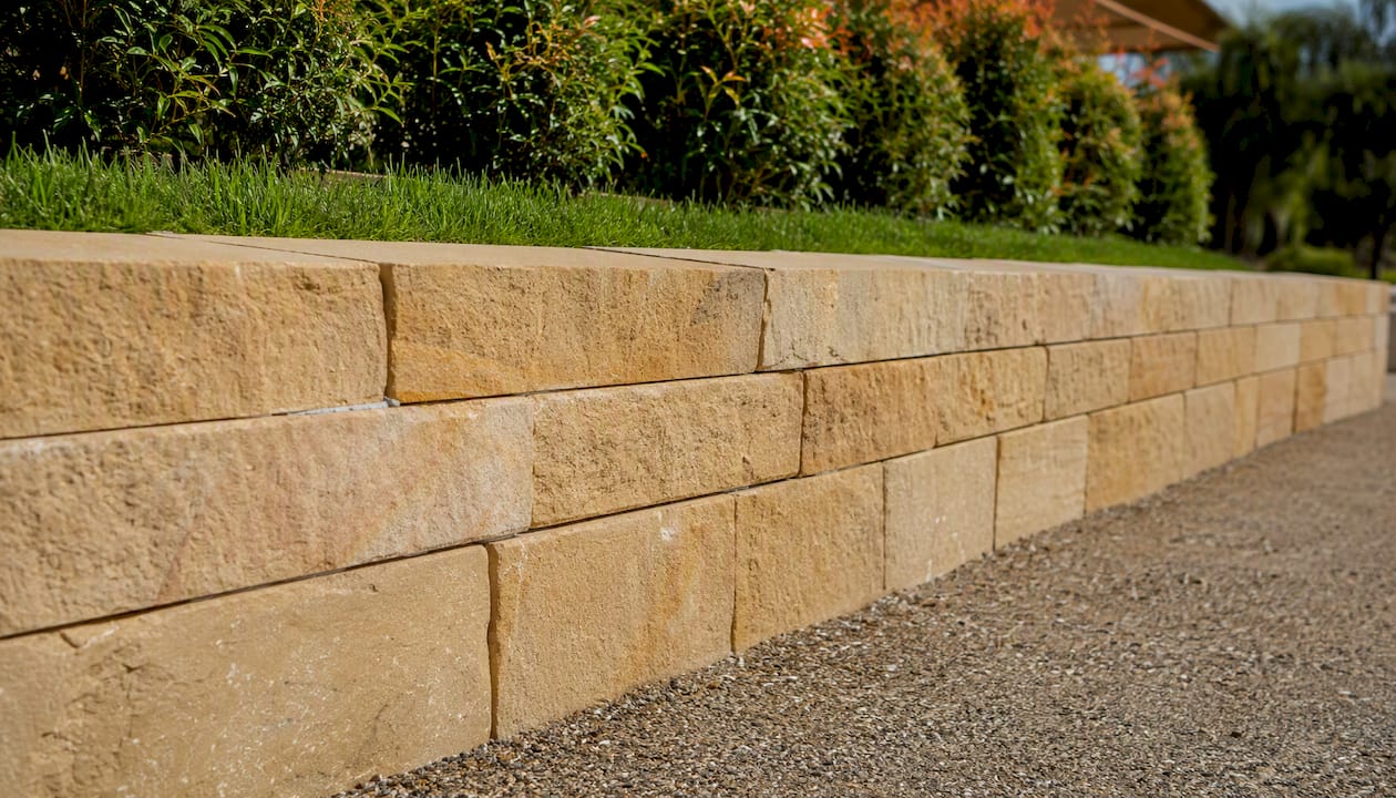 Close-up sandstone retaining wall quad-sawn uniform blocks