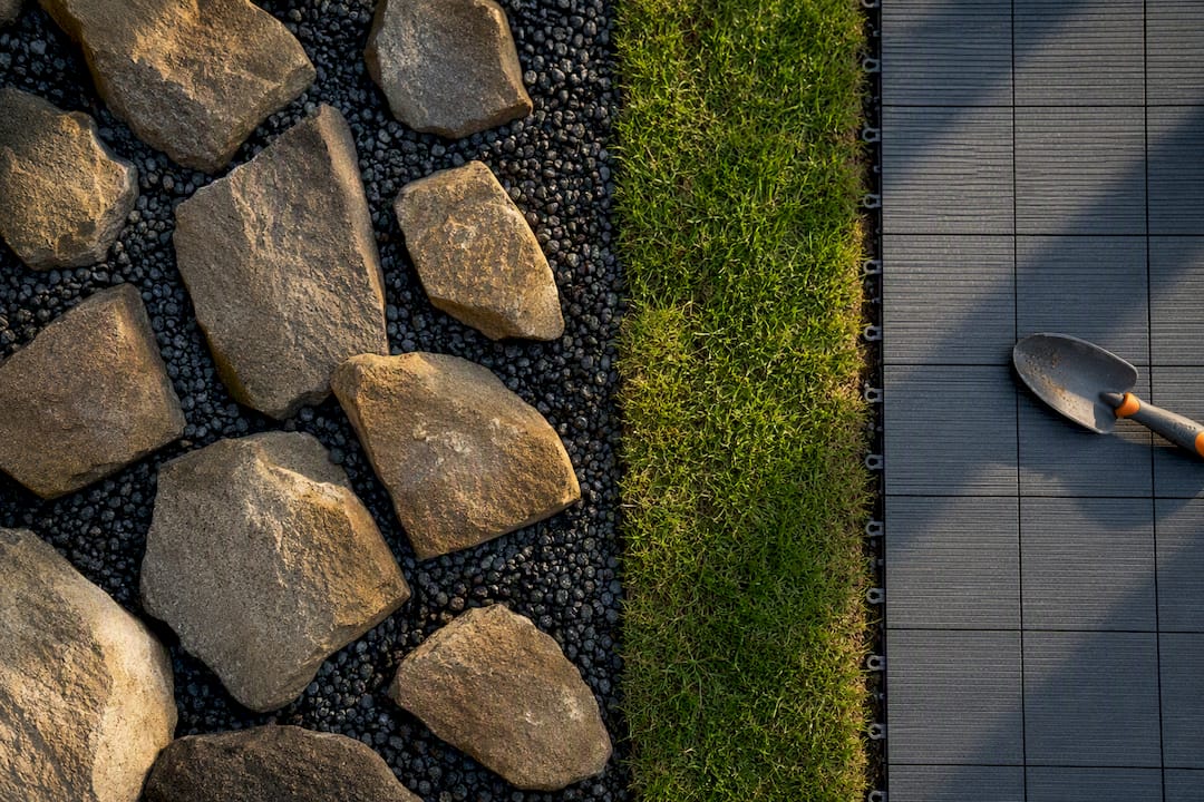 Loose boulders beside accessible easement landscaping