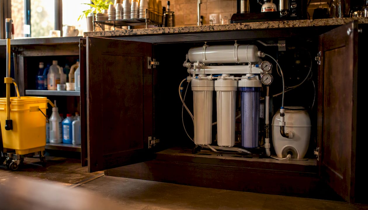 Under-sink reverse osmosis system in restaurant utility room