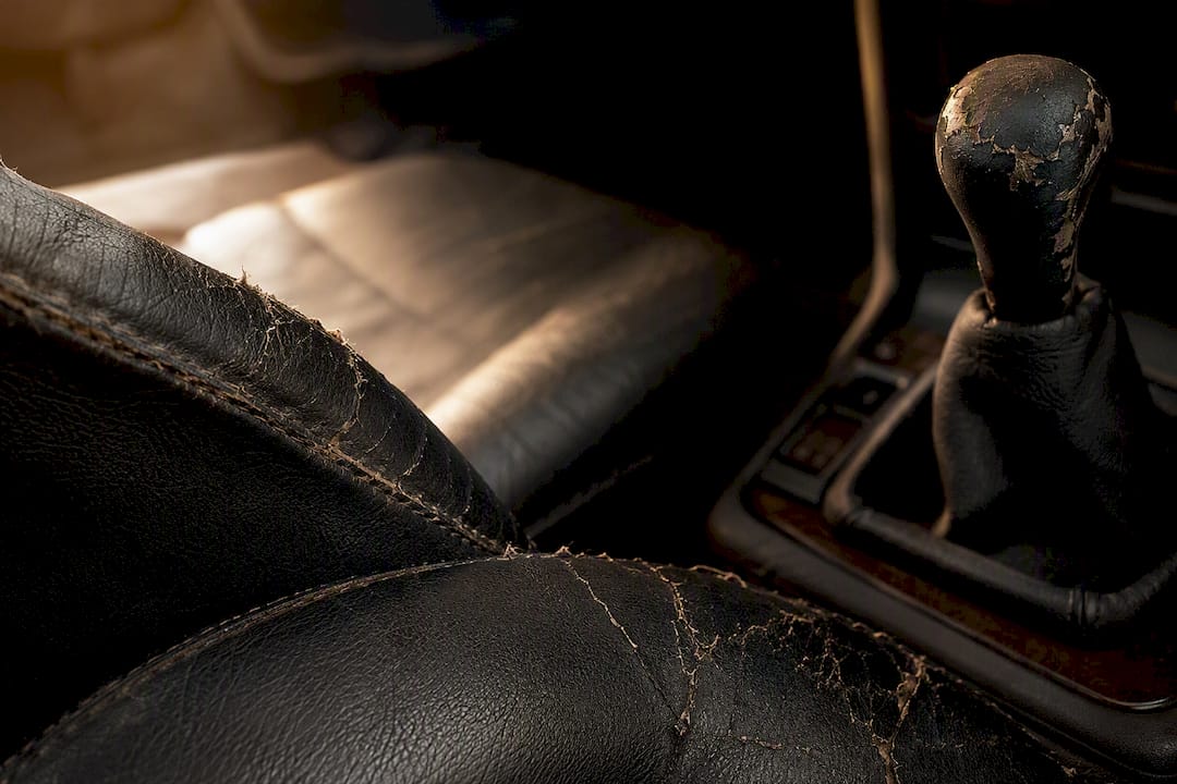 Close-up of worn car interior details