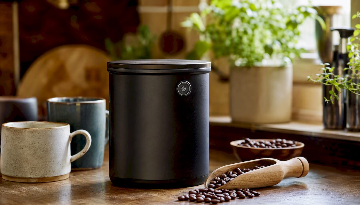 Airtight coffee canister with CO2 valve on kitchen shelf
