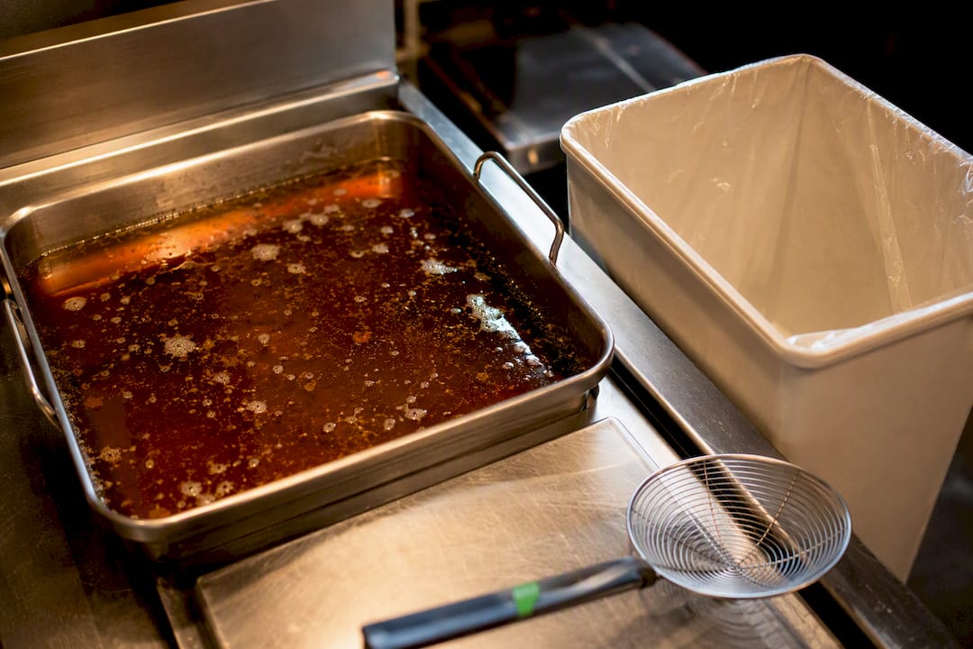 Darkened reused oil in a saucepan