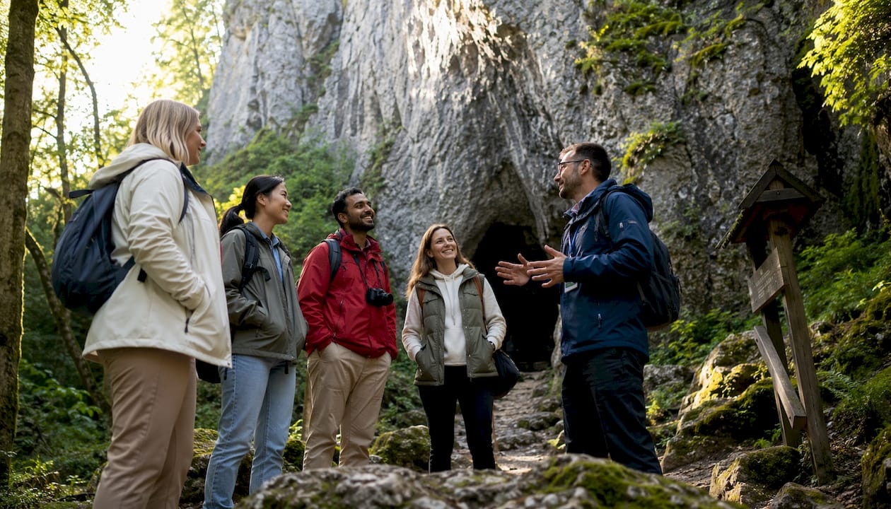 Tour group waiting at King Łokietek Cave entrance