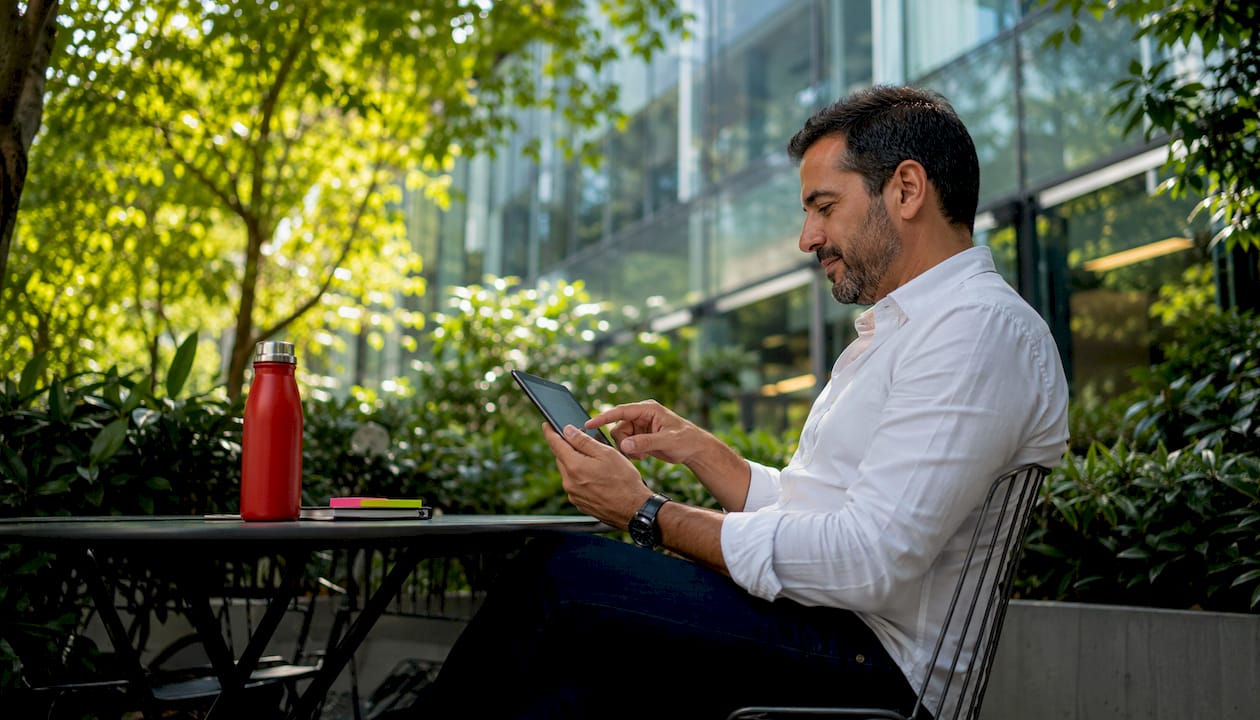 Man booking curated city tours indoors