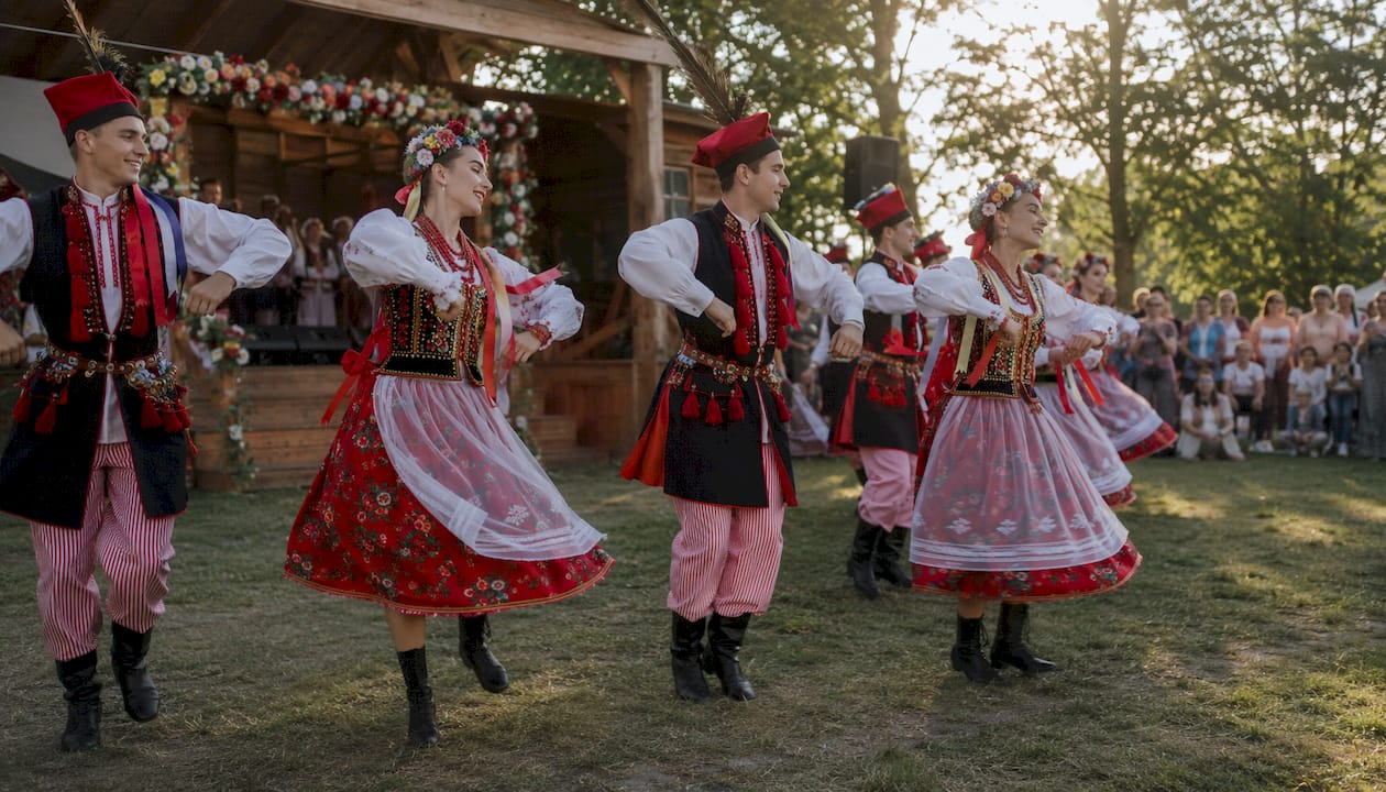 Krakowiak folk dancers performing on stage