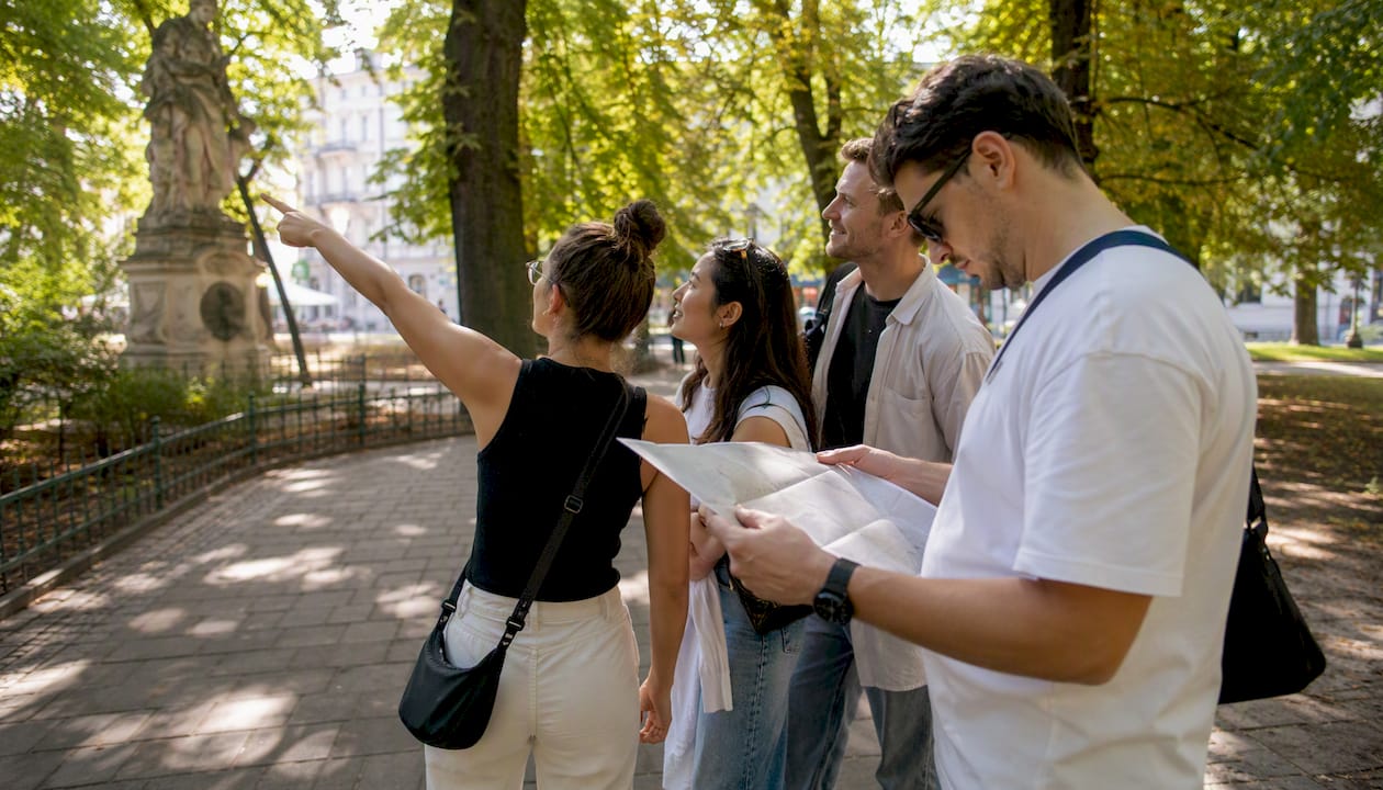 Corporate team playing city treasure hunt in Krakow