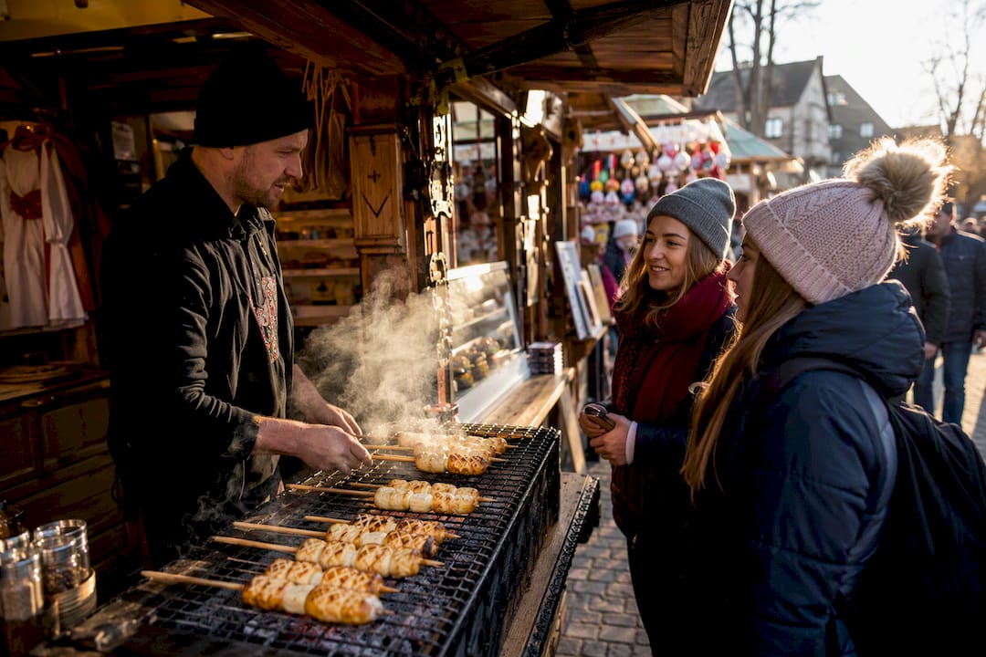 Grilled oscypek cheese on skewers at street stall