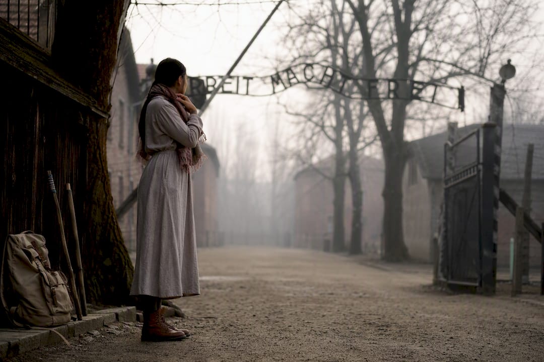 Modest clothing detail at Auschwitz entrance