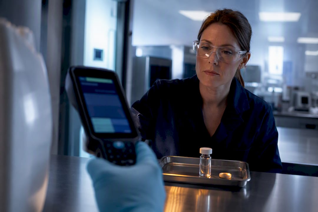 Technician capturing chemical batch identification