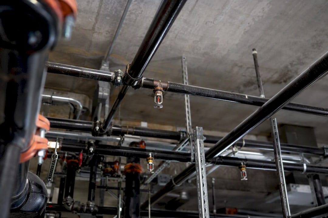 Sprinkler system pipes and fittings in mechanical room