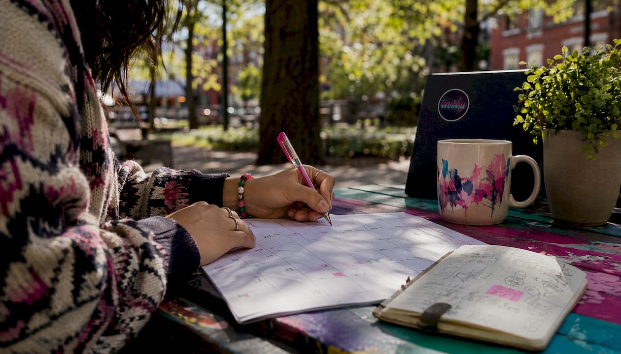 Music Release Strategy for Independent Artists: 2026 Guide - 1784474731700 Hands marking release dates on calendar Hands marking release dates on calendar