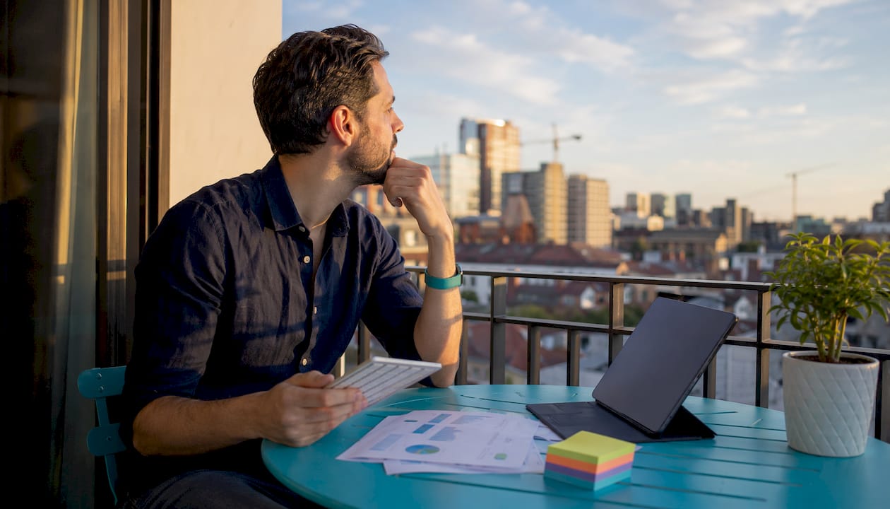 Marketer evaluating AI poster tools at desk