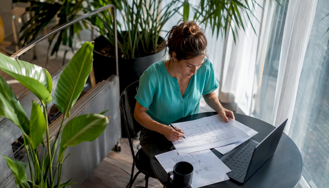 Content creator editing episodic video at desk