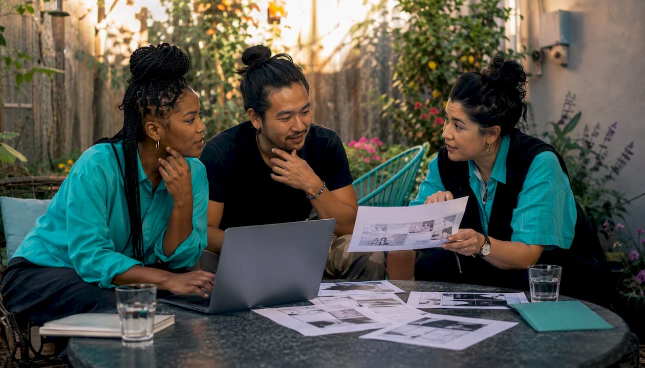 Diverse film team collaborating on storyboards