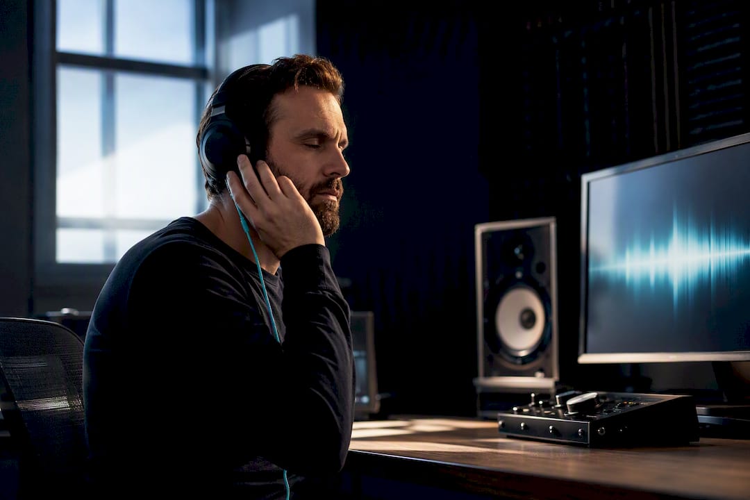 Producer reviewing music clearance in studio