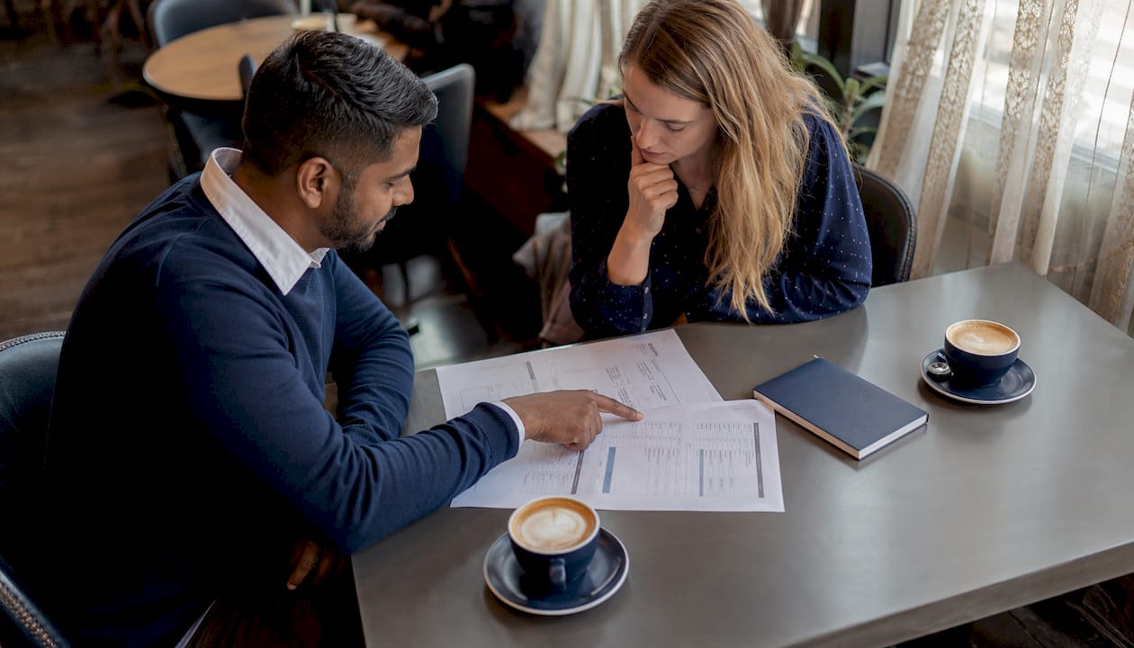Two people discussing loan options