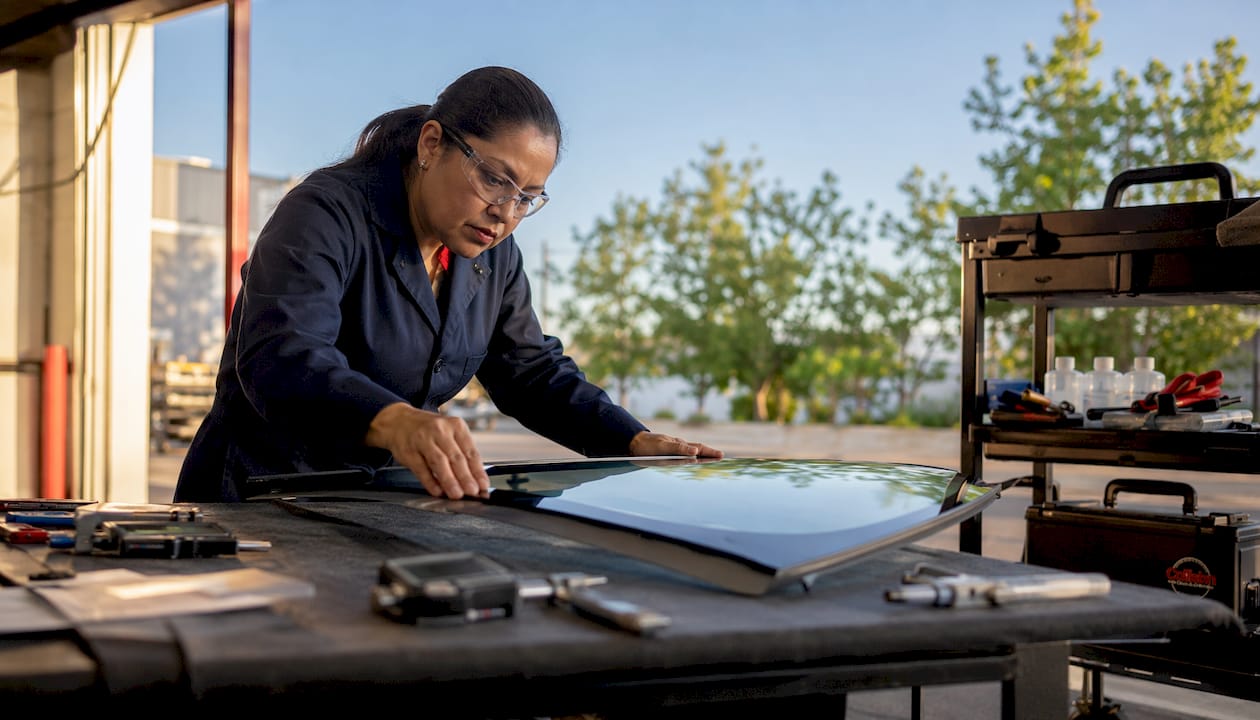 Engineer inspecting OEM windshield quality