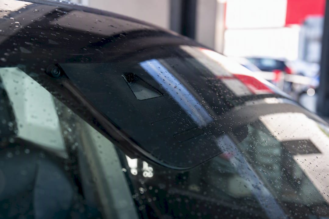 Close-up of rain sensor module on windshield interior