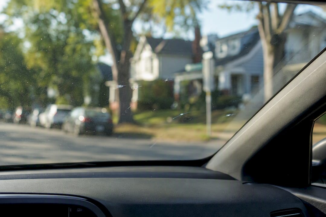 Close-up of resin-filled rock chips on windshield