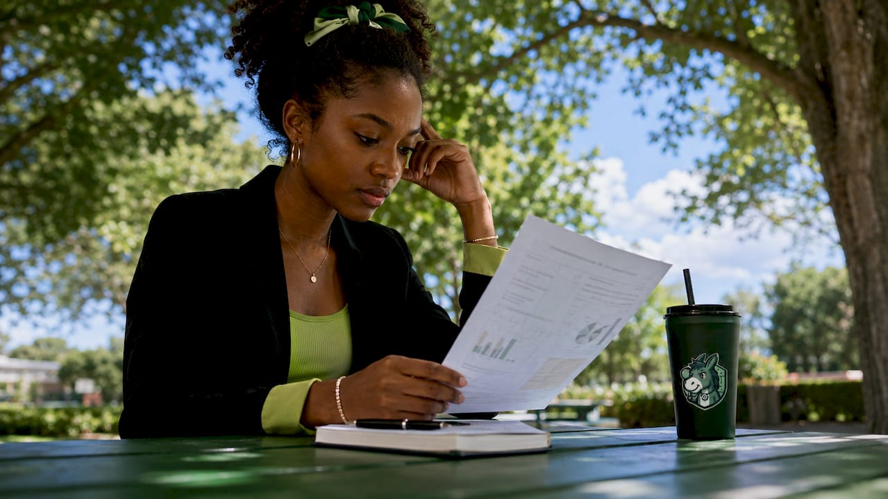Young woman analyzing expected value outdoors