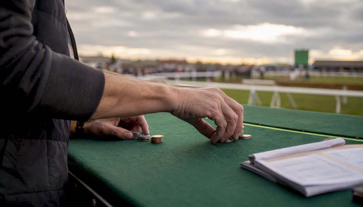 Hands placing lay and back bets in sequence