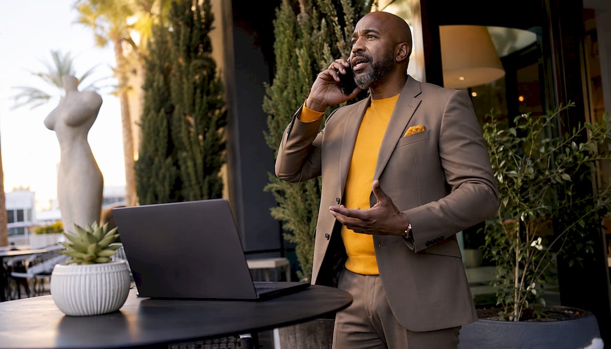 Man consulting on domain name by phone