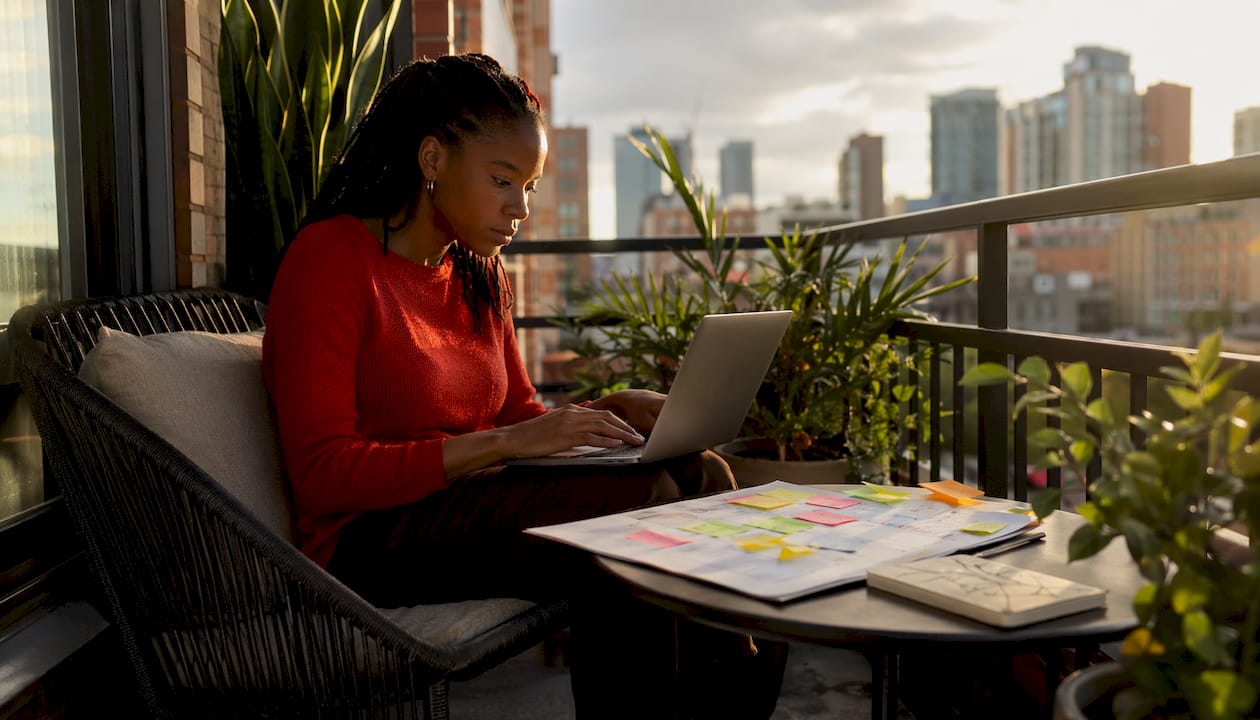 Woman planning Twitter content calendar at desk