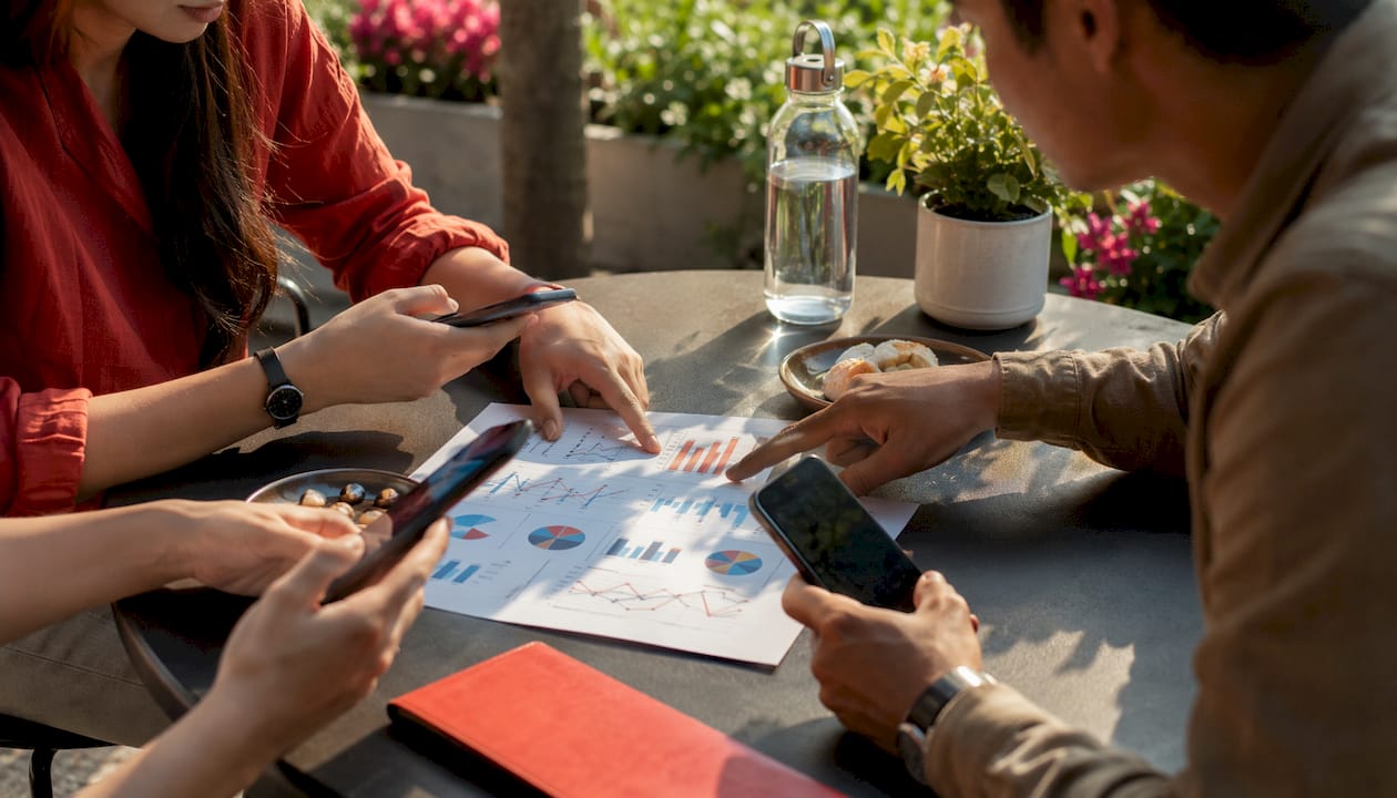 Hands reviewing social media creator vetting data
