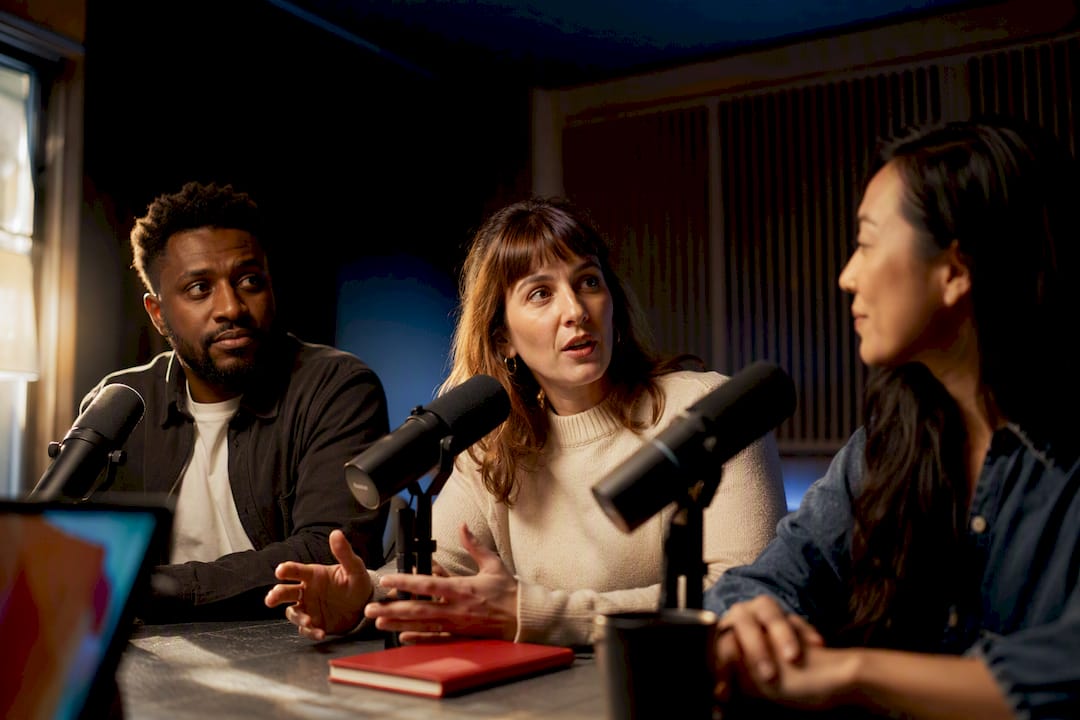 Host and guests recording live audio discussion