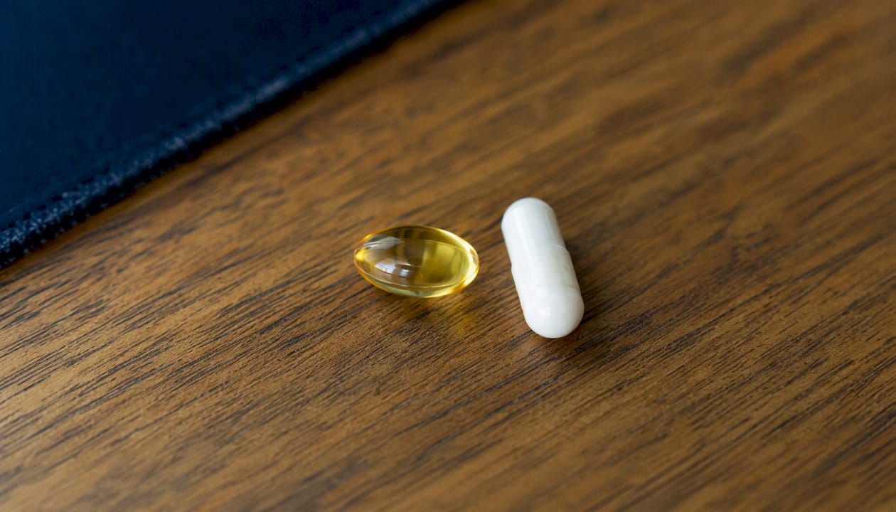 Softgel and tablet cannabis capsule close-up