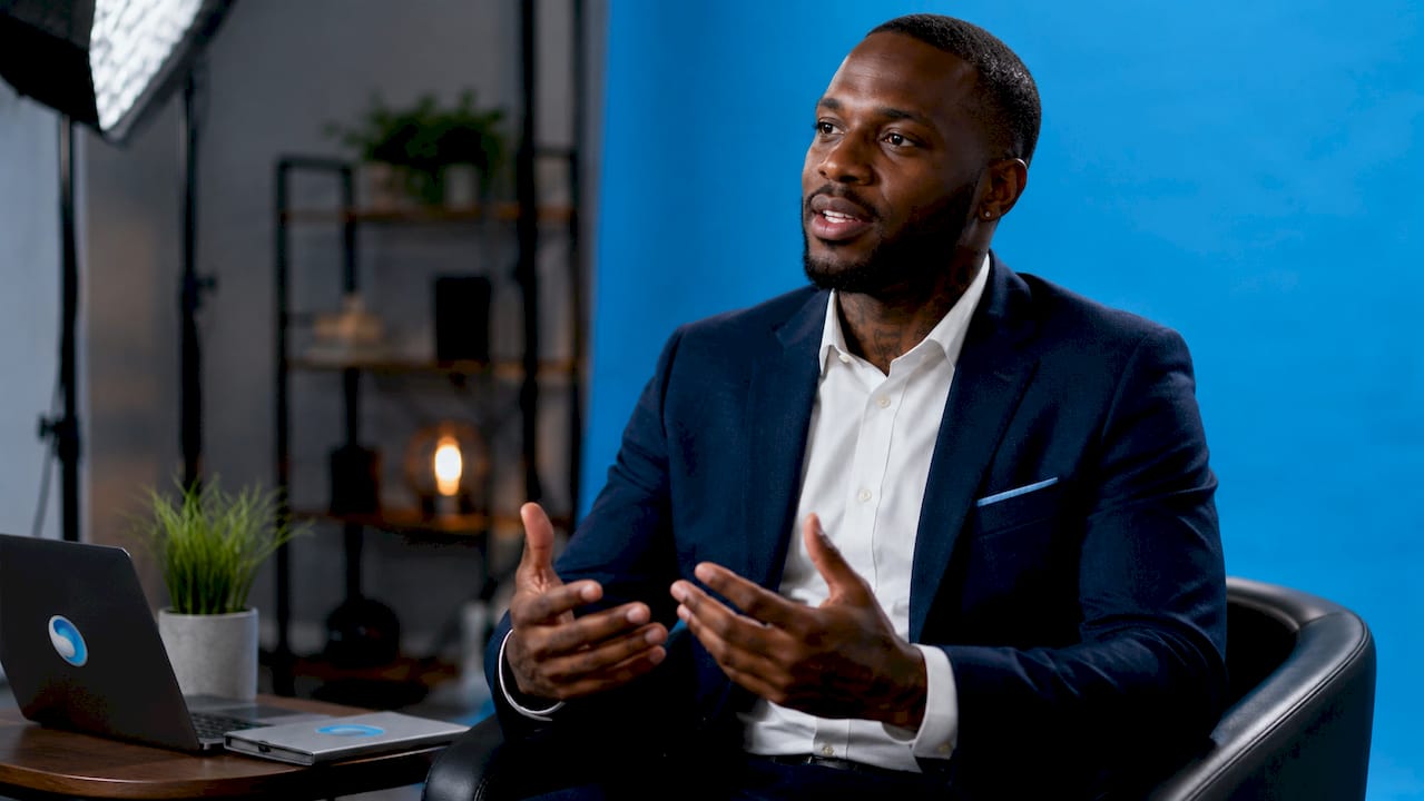 Man lit by professional three-point lighting in studio
