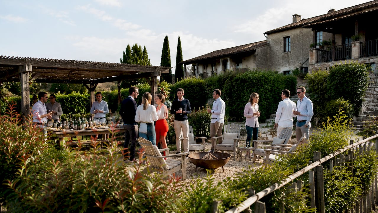 Villa with large team socializing outdoors